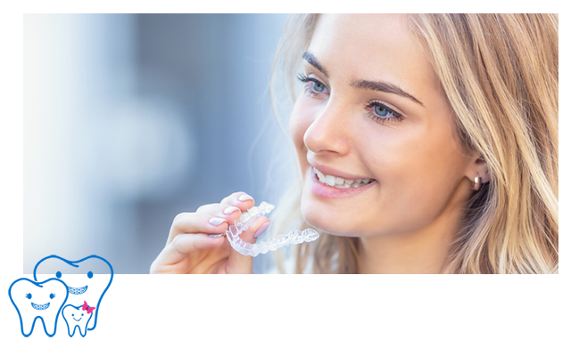 Patient using a clear orthodontic aligner