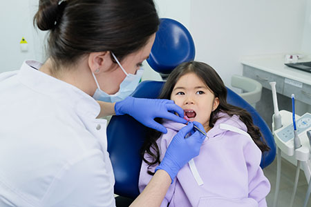 Child receiving pediatric dental care